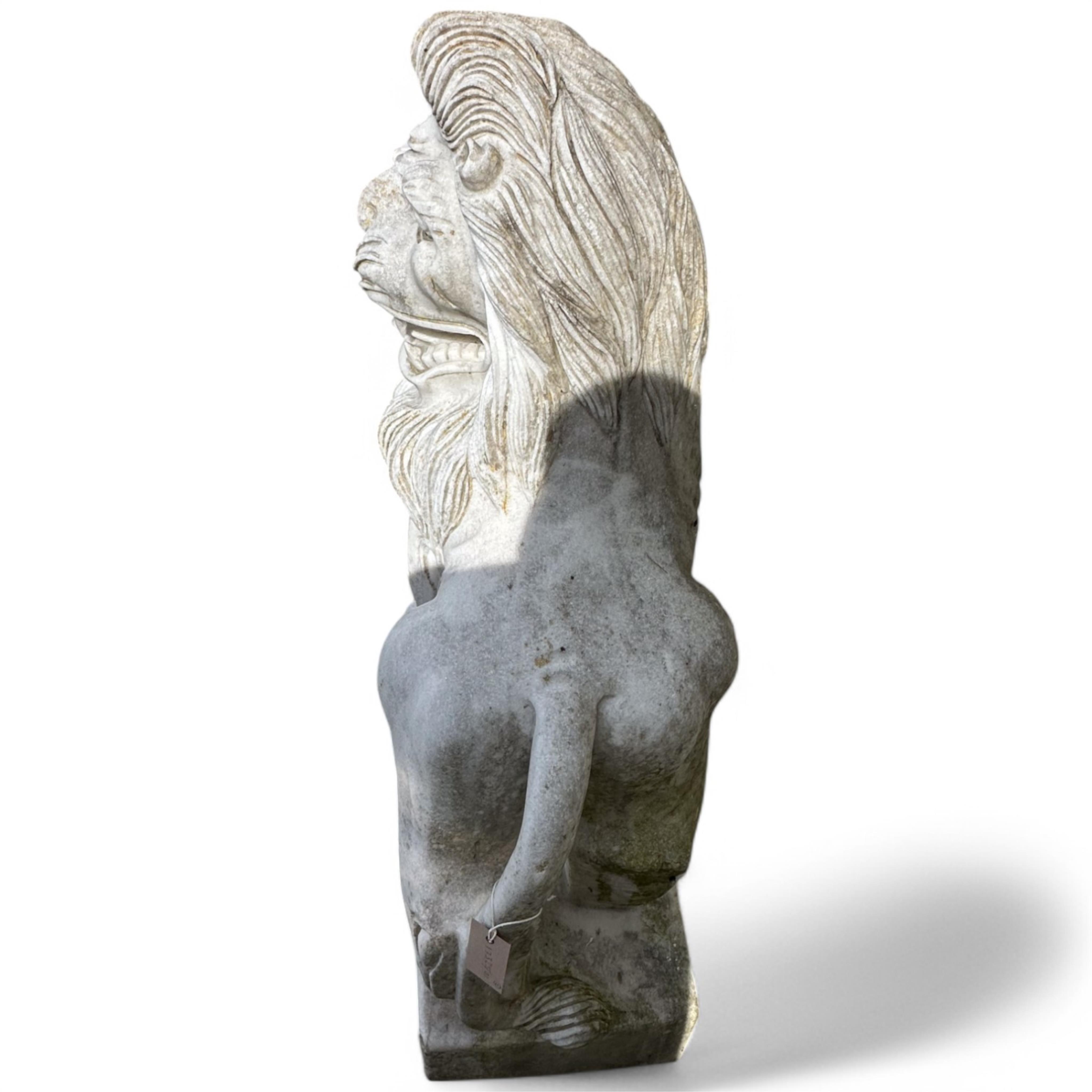 A pair of reconstituted white marble models of lions rampant